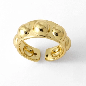 Detail of gold-plated adjustable ring featuring a unique 3D bubble textured surface