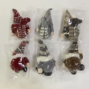 Detailed flat lay of 6 Christmas gnomes with striped knit hats and plush white beards