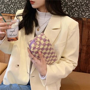 Detailed knit checkered makeup bag in purple and beige with a durable zipper closure