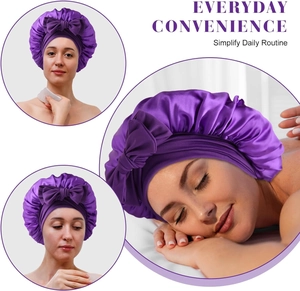 Detail showing the purple satin hair bonnet for sleeping with elastic wide band and bow