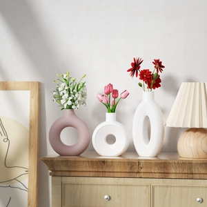Three-piece modern ceramic vase set with matte texture and hollow circular designs