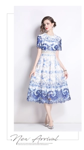 Detailed view of hollow water-soluble lace and blue floral print on midi dress