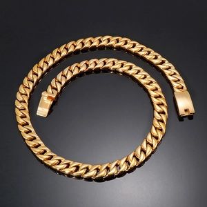 Detailed view of a 12mm golden Cuban link necklace with a secure box clasp on black background