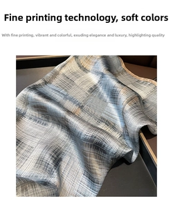 Detailed view of the fine printing technique and soft luster on a silk striped scarf