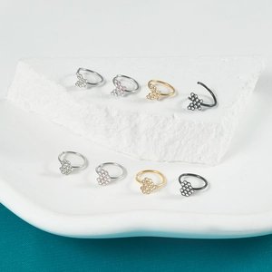 Set of stainless steel nose rings in gold silver and black with pavé crystal accents