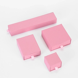 Pink drawer jewelry box collection in four sizes with ribbon handles for gift storage