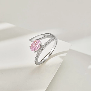 Close-up of S925 silver ring featuring an oval pink gemstone and pavé diamonds