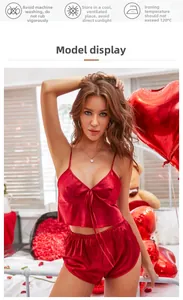 Macro shot of red satin pajama set featuring V-neck camisole and matching elastic shorts