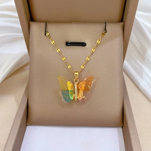 Elegant gold titanium necklace with colorful gradient butterfly pendant and crystals