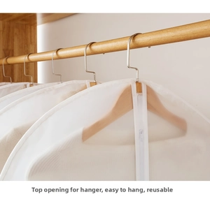 Detail view of the PEVA garment cover top opening for hangers and smooth zipper closure