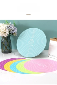 Detail of round silicone baking mats with measurement scales in six assorted colors