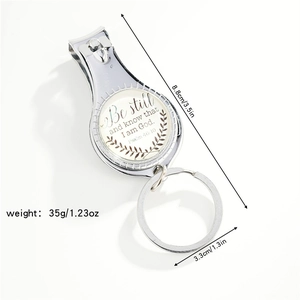 Detail view of nail clipper keychain with dimensions 8.8cm and religious quote
