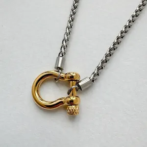 Polished 18K gold carabiner clasp on silver stainless steel wheat chain necklace