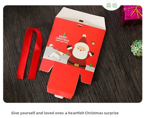 Detail view of a red Christmas gift box with Santa motif and matching satin ribbon