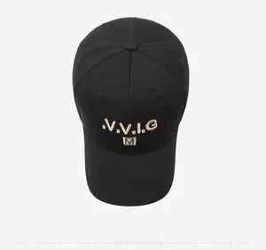 Top view of black baseball cap with golden V.V.I.G and M embroidery and fabric texture
