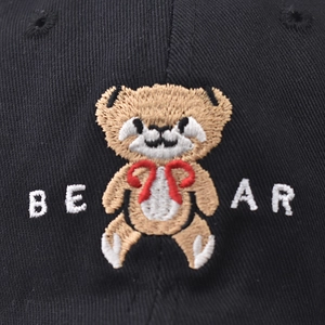 Short brim black cotton baseball cap featuring embroidered brown teddy bear and letters