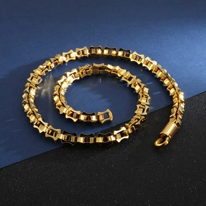 Close-up of 18K gold plated stainless steel square link chain with polished finish