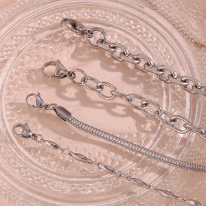 Set of four silver stainless steel chain bracelets including snake and pearl link styles