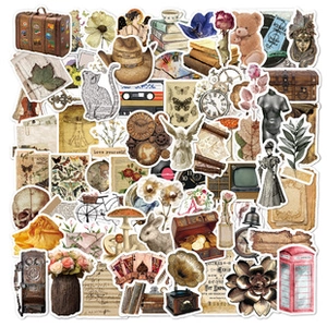 Close-up of vintage aesthetic stickers featuring teddy bears, retro books and gramophones