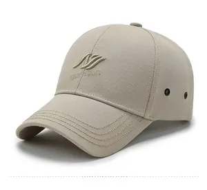 Detailed close-up of light beige baseball cap with 3D narason embroidery and eyelets