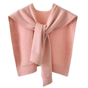 Detailed view of the soft pink knit texture and ribbed hem of the shawl cardigan