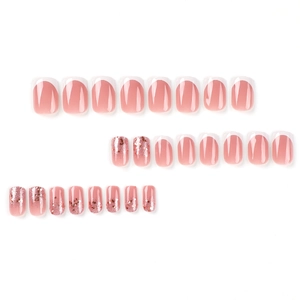 Set di unghie finte French bianche con base rosa nude e accenti di glitter