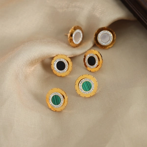 Three pairs of vintage gold plated titanium steel round stud earrings with diamonds and gems
