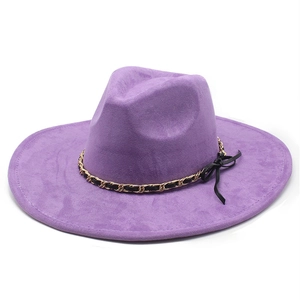 Detail of purple wide brim fedora hat with gold chain band and black ribbon bow accent