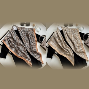 Elegant houndstooth silk scarves in two colorways styled with fashionable accessories