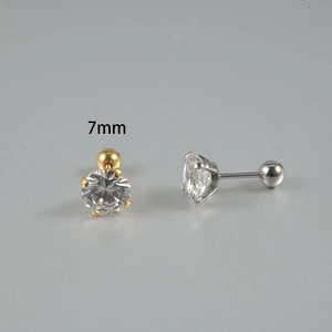 Detail of 7mm cubic zirconia stud with four-prong setting and screw ball back