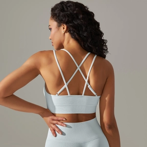 Detail view of the light blue seamless criss-cross sports bra and ribbed workout set