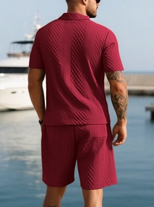 Macro shot of men's burgundy waffle texture polo set on a luxury resort background