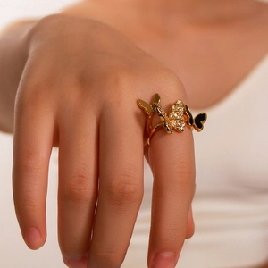 Adjustable golden stainless steel ring featuring triple butterfly with zircon and black enamel