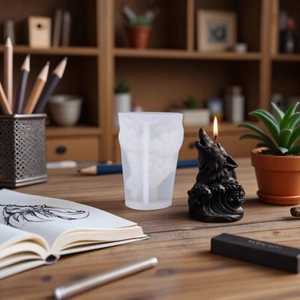 Wolf head and wave silicone mold for DIY candles on a wooden desk with creative decor