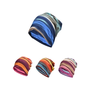 Close-up of multicolored striped knitted beanie hats showing texture and patterns