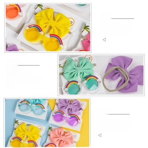 Detail of cotton bow headband and rainbow sunglasses with resin cloud ornaments
