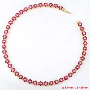 Macro detail of luxury flower necklace with pink and white zircon gemstones in gold plating