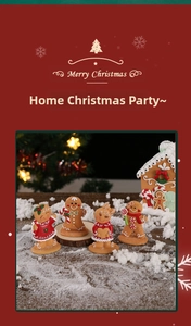 Close-up of resin gingerbread men and house figures on a snowy Christmas scene