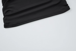 Detailed close-up showing the smooth black fabric texture and neat hemline stitching on vest