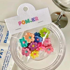 Candy colored flower hair clips set with matte finish in 45-degree top view