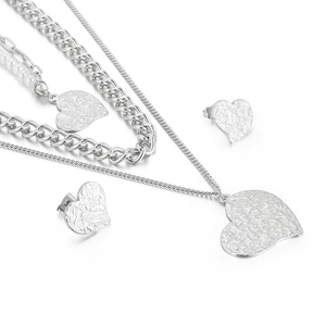 Silver double-layered heart necklace and earrings set with hammered metal texture