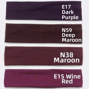 Close-up of four elastic cotton sports headbands in purple and wine red color variants