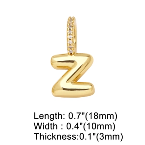 Macro shot of 18k gold letter Z heart pendant with white zircons and dimensions
