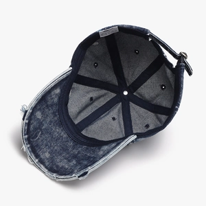 Inside view of vintage blue washed cotton baseball cap with adjustable metal buckle strap