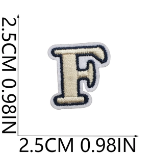 Close-up of small letter F embroidery patch showing 2.5cm size measurement on white background