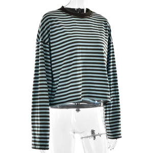 Detail of blue and black striped long sleeve crop top on a clear female mannequin