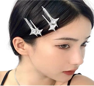 Close-up of model wearing Y2K star hair clips with silver metal and zircon stones