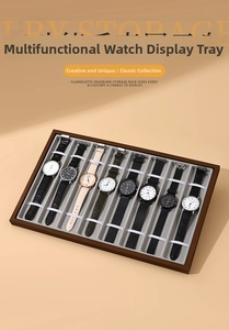 Detailed view of an 8-slot dark walnut wood grain watch display tray with grey velvet lining