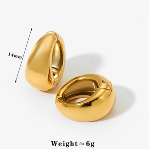Macro detail of 14mm golden water-drop earrings with mirror polished finish