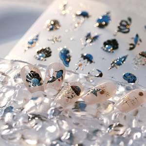 Ocean themed nail stickers set with gold embossed shell and jellyfish patterns
